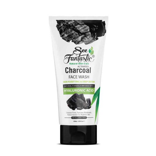 A 100ml tube of See Fantastic Activated Charcoal Face Wash, shown with charcoal and green leaves on a white background. The label highlights deep pore cleanse, oil control, and detox benefits for men & women in Pakistan.